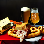 Still life with beer pretzel cheese and salami